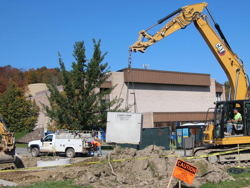 Cranes work outside of the Orvis Activities Center on the infrastructure project. Alfred State has $100 millions dollars of improvement underway. 