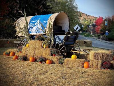 Covered wagon display at the main entrance of Alfred State College.