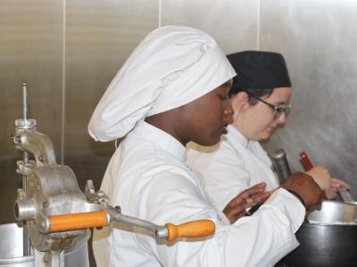 Culinary Arts students work in the kitchen.