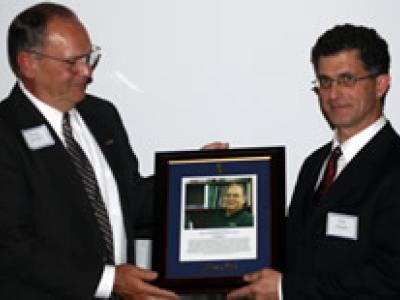 Doug Barber receives plaque from Ron Rosati