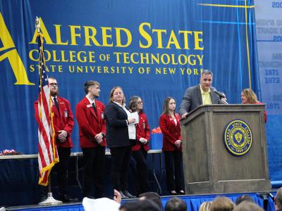 Alfred State President Dr. Steven Mauro speaks with the students that competed during the 34th annual Skills USA competition during the awards ceremony.
