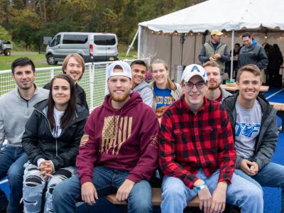 Alfred State graduates enjoy the End Zone Party at a past Homecoming/Family Weekend.