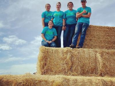 Alfred State agriculture students help at Livingston County Farm Fest (L to R): Hope Avedisian, Elyssa Desotelle (kneeling), Emma Dominic, Abby Beidel, and Tyler Norton.