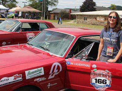 Olivia Gadjo outside of her team’s 1966 Ford Mustang.