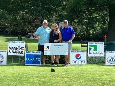 The winning team of Gary Harwood, Kandi Geibel, and Brent Geibel