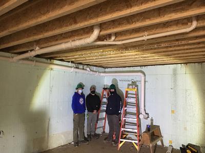 HVAC students assist with plumbing