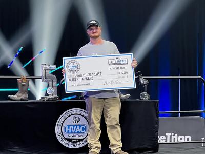 Johnathon Helms with his prize check