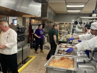 Preparing takeout spaghetti dinners