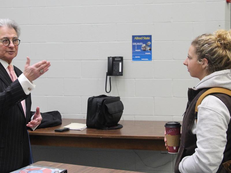 John Ninfo speaks with Emma Bower, an Agriculture Entrepreneurship major, following one of the three presentations he made at Alfred State about student finances.