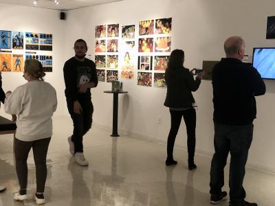 Visitors of the Bret Llewellyn Gallery enjoy projects by Alfred State Digital Media and Animation students.