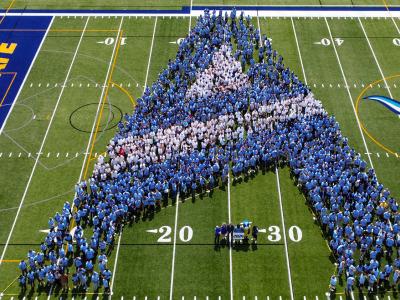 Student make an A on the football field