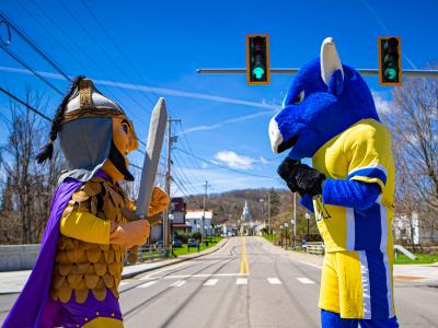 Mascots pose under the stoplight
