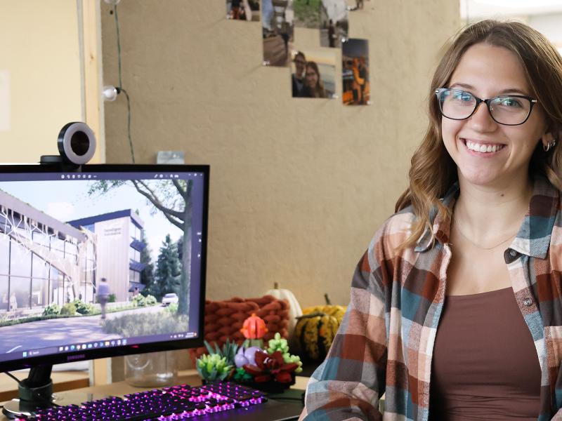 Student sits in front of her computer