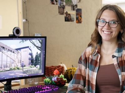 Student sits in front of her computer