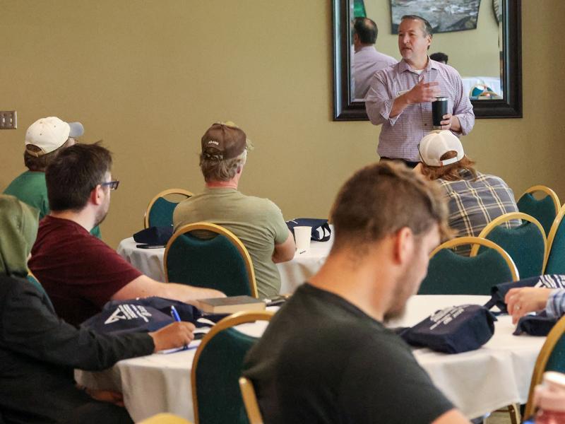 John Williams speaks with new faculty