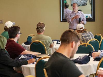 John Williams speaks with new faculty