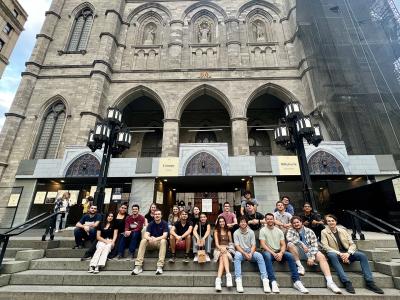 Alfred State architecture students sit in front of Notre-Dame Basilica in Montreal