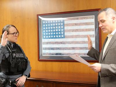 Officer Jessica Middaugh is sworn in by Alfred State President Dr. Steven Mauro.