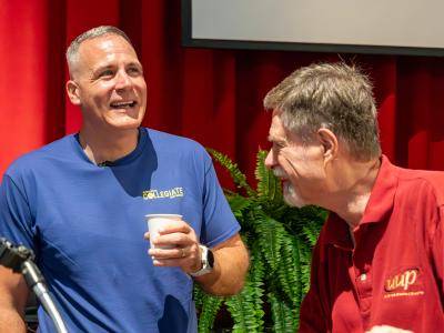 Dr. Mauro speaks with a faculty member