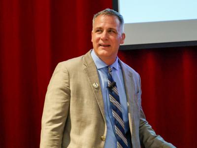 Dr. Mauro speaks in front of an audience