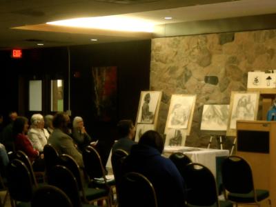 An Alfred State student recites an original poem.