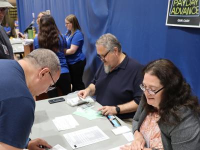 Faculty and staff participate in a poverty simulation