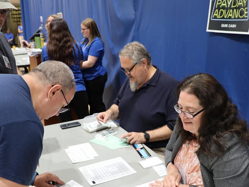 Faculty and staff participate in a poverty simulation