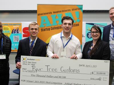 Pyur Tree Customs poses with the judges and the prize money.