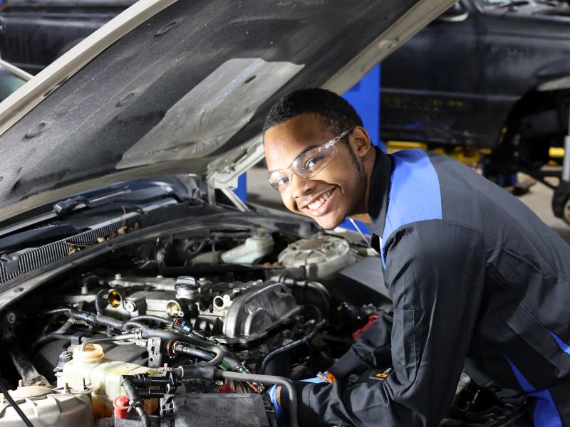 Student works on a car