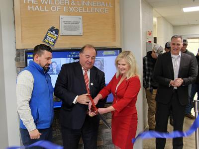 J. Joseph Wilder and his wife Laura Linneball cut the ribbon at the Hall of Excellence located in the Workforce Development Center on the Wellsville campus. Joining them are Director of Development Jason Sciotti (far left) and ASC President Dr. Steven Mau