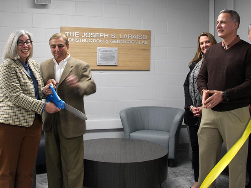 Joseph Laraiso cuts the ribbon for the new Construction & Geomatics Lab in the Engineering Building.