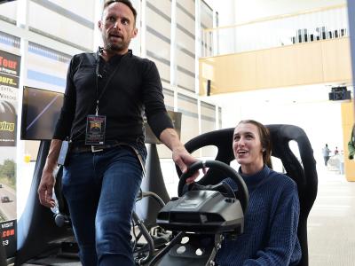 student participates in a driving simulation