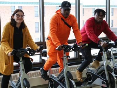 People riding spin bikes