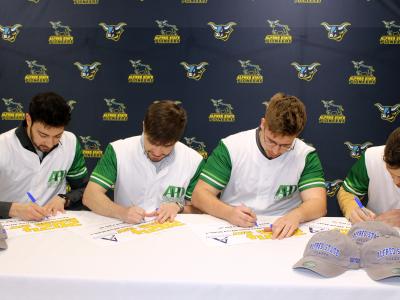 Students celebrate signing for their new jobs.