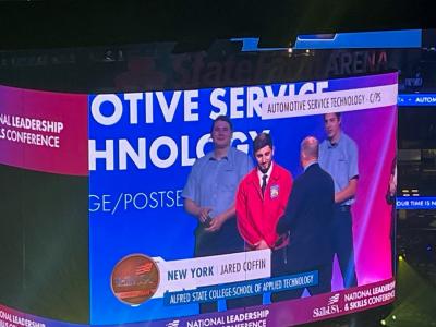 Jared Coffin receives his award for placing 3rd in the Automotive Service Technology competition at the SkillsUSA National Championships.