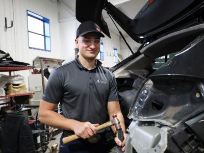 student works in autobody shop