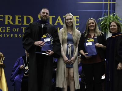 Mark Bloxsom and Jennifer Ross pose after getting an award
