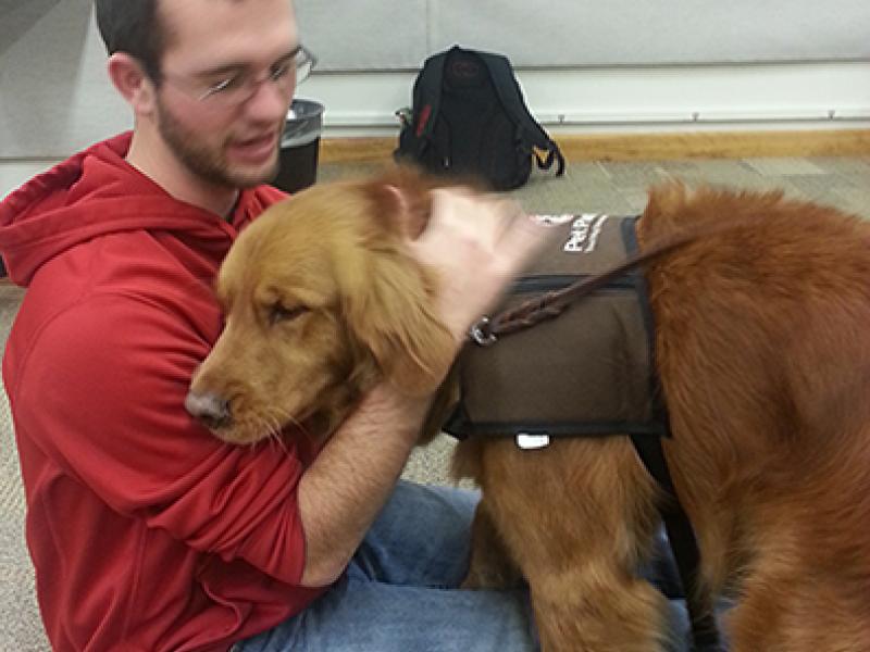 Student with therapy dog