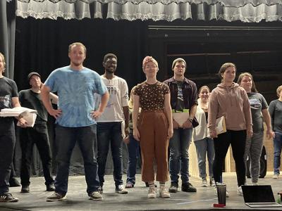 Members of the cast of “Sweeney Todd” take a break from a recent rehearsal.
