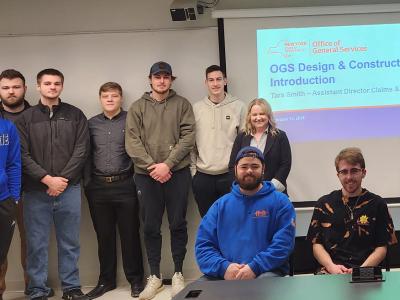 students with an alumni guest speaker in class