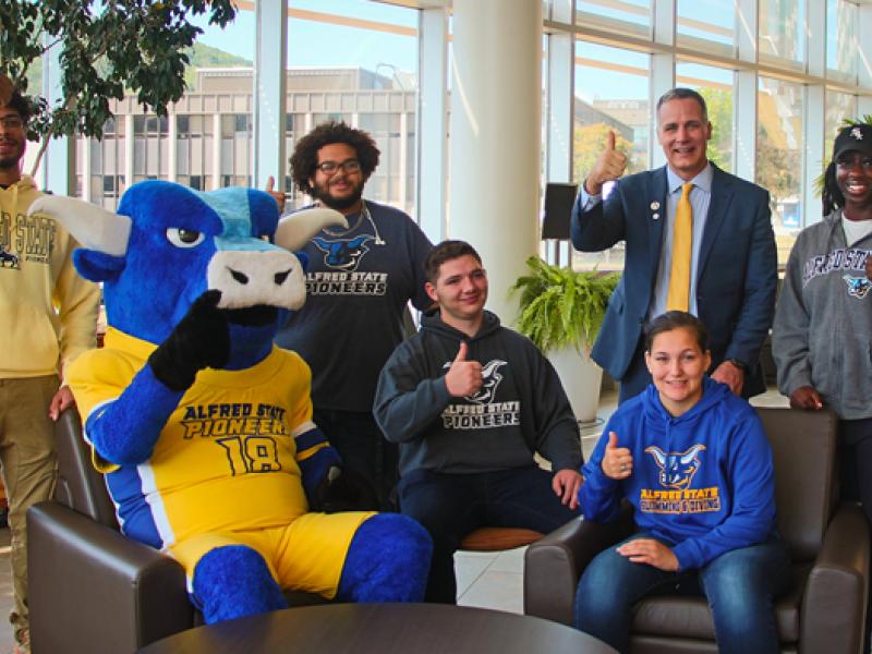 Dr. Mauro celebrates with students and Big Blue the mascot as US News again ranks Alfred State the #1 SUNY regional college. 