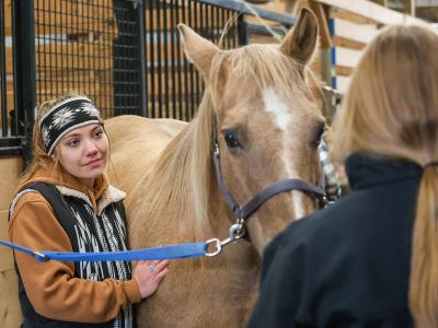 student with a horse