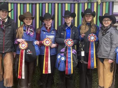 Members of the western equestrian team show off their awards