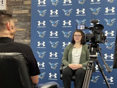 Alfred State wrestler being interviewed by WKBW