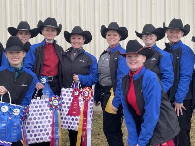 The western equestrian team poses for a team picture following a show
