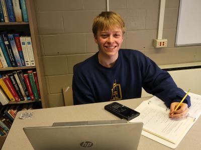 student working on math homework