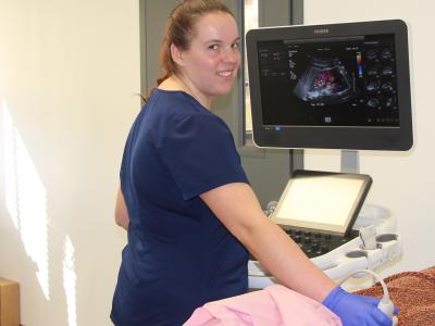 Student scans a patient.