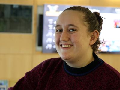 Student standing in Student Leadership Center