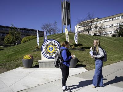 Students chatting in the middle of college campus