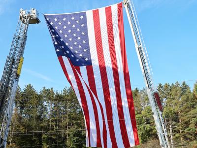giant flag displayed on the Wellsville campus